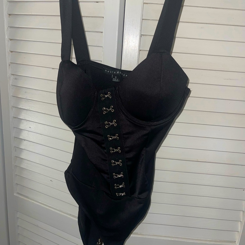 black bodysuit with hook and eye details and built in cups like new